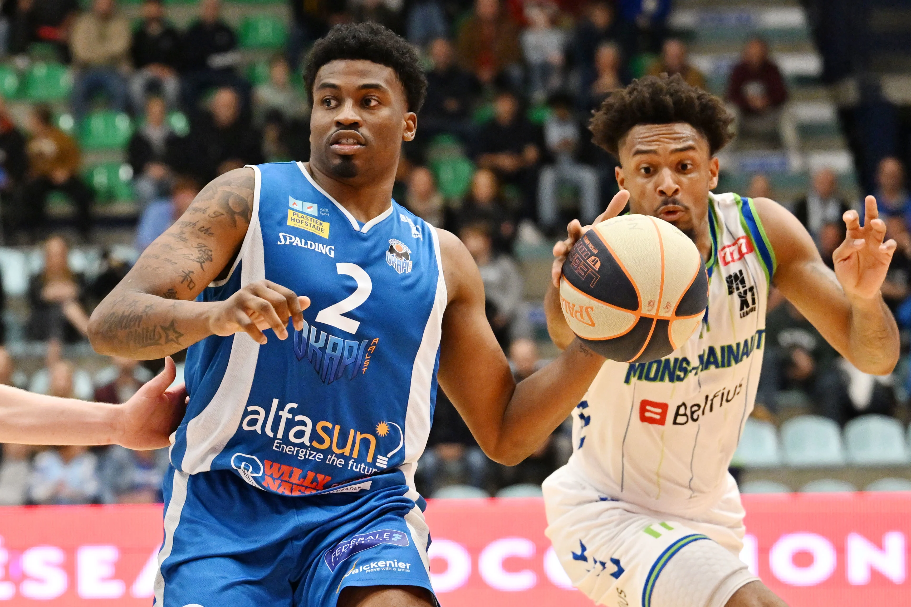 Aalst's Donovan Gregory and Mons' Zaccharie Mortant fight for the ball during a basketball match between Mons-Hainaut and Okapi Aalstar, Saturday 28 September 2024 in Mons, on day three of the 'BNXT League' first division basket championships. BELGA PHOTO MAARTEN STRAETEMANS