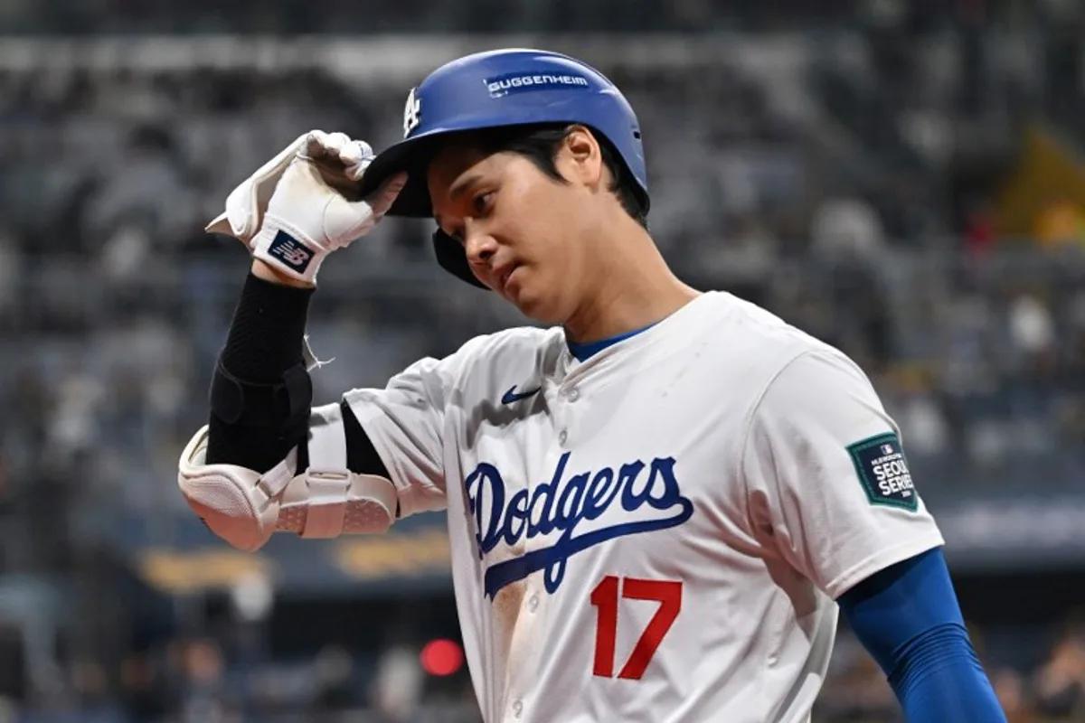 Los Angeles Dodgers' Shohei Ohtani reacts after flying out in the 7th inning of the 2024 MLB Seoul Series baseball game 2 between Los Angeles Dodgers and San Diego Padres at the Gocheok Sky Dome in Seoul on March 21, 2024.  Jung Yeon-je / AFP