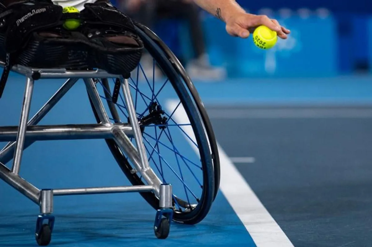 France's Nicolas Peifer serves against Britain's Alfie Hewett and Gordon Reid during their men's doubles gold medal match at the Tokyo 2020 Paralympic Games at Ariake Tennis Park in Tokyo on September 3, 2021.  Philip FONG / AFP