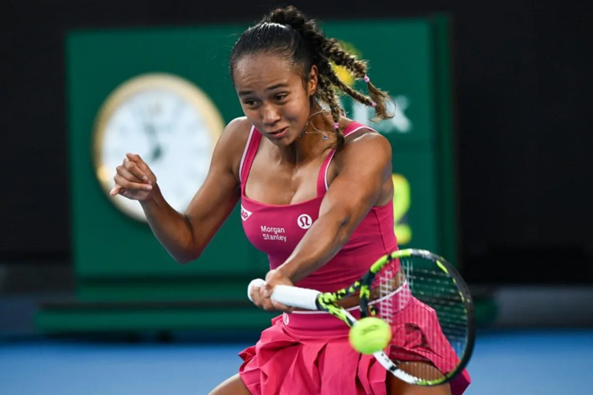 Canada's Leylah Fernandez hits a return against USA's Coco Gauff during their women's singles match on day six of the Australian Open tennis tournament in Melbourne on January 17, 2025. Paul Crock / AFP
