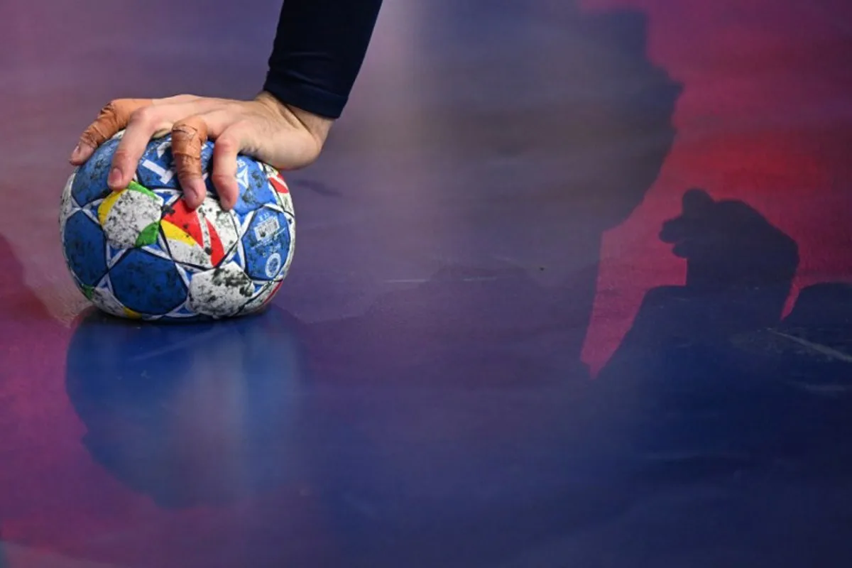 France's centre back #05 Nedim Remili holds the ball during the Men's EURO 2024 EHF Handball European Championship final match between France and Denmark in Cologne, western Germany on January 28, 2024.  Kirill KUDRYAVTSEV / AFP