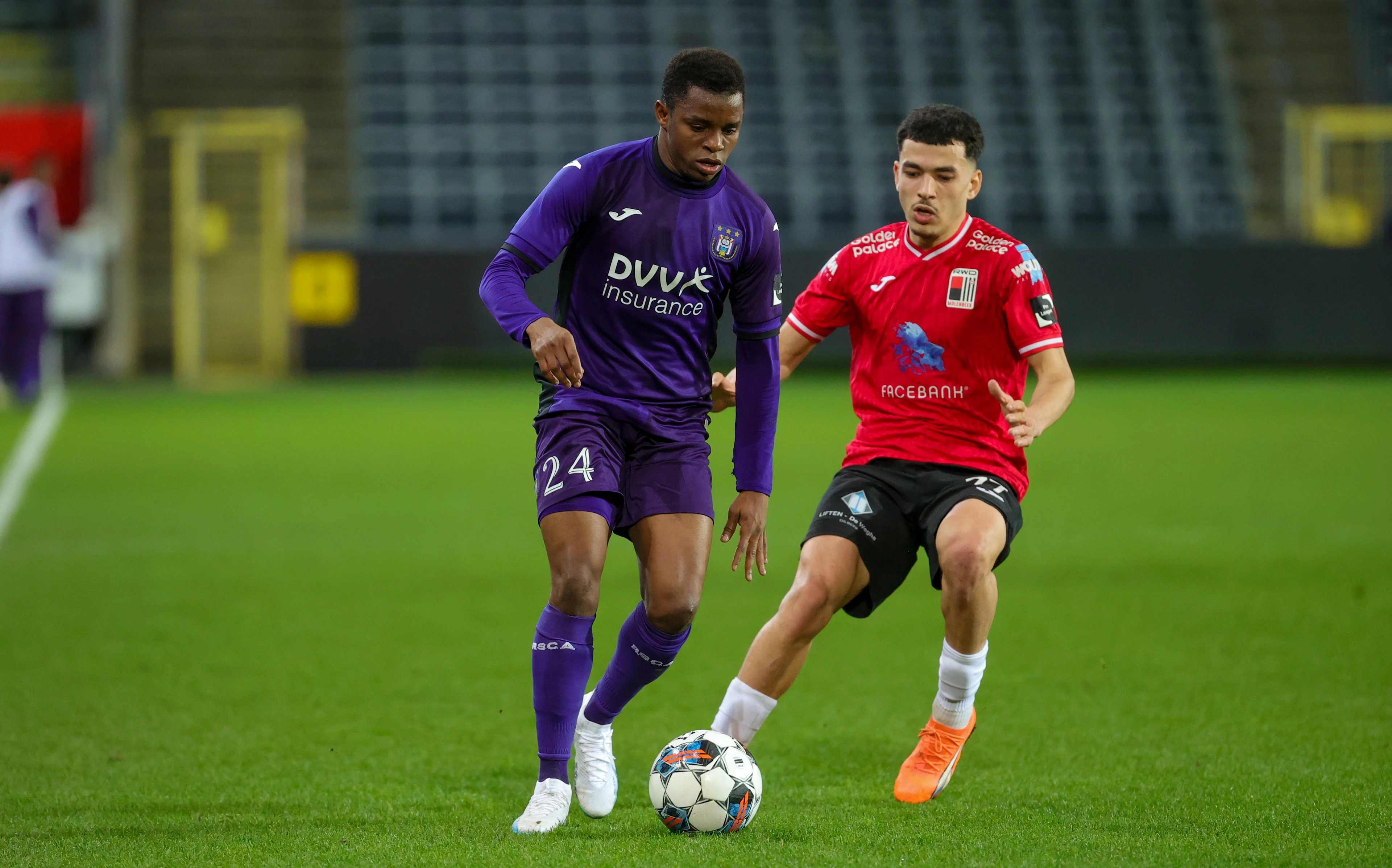 RSCA Futures' Ishaq Abdulrazak and Rwdm's Zakaria El Ouahdi fight for the ball during a soccer match between RSCA Futures (Anderlecht U23) and RWD Molenbeek, Saturday 18 March 2023 in Brussels, on day 4 (out of 10) of the Promotion Play-Offs of the 2022-2023 'Challenger Pro League' 1B second division of the Belgian championship. BELGA PHOTO VIRGINIE LEFOUR