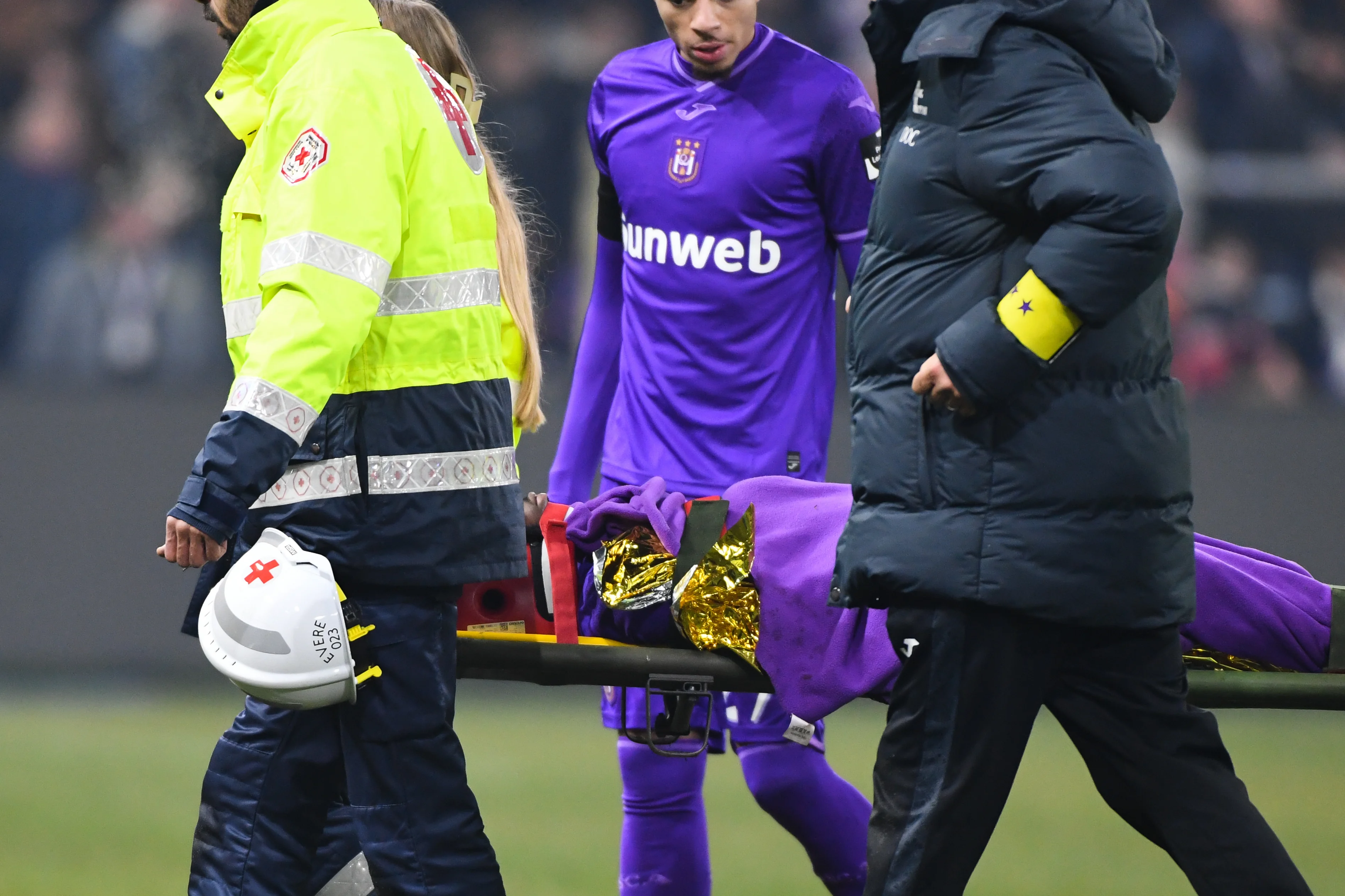 Anderlecht's Francis Amuzu and is carried of the pitch during a soccer game between RSC Anderlecht and Club Brugge, Sunday 12 January 2025 in Brussels, on day 21 of the 2024-2025 season of 'Jupiler Pro League' first division of the Belgian championship. BELGA PHOTO JILL DELSAUX