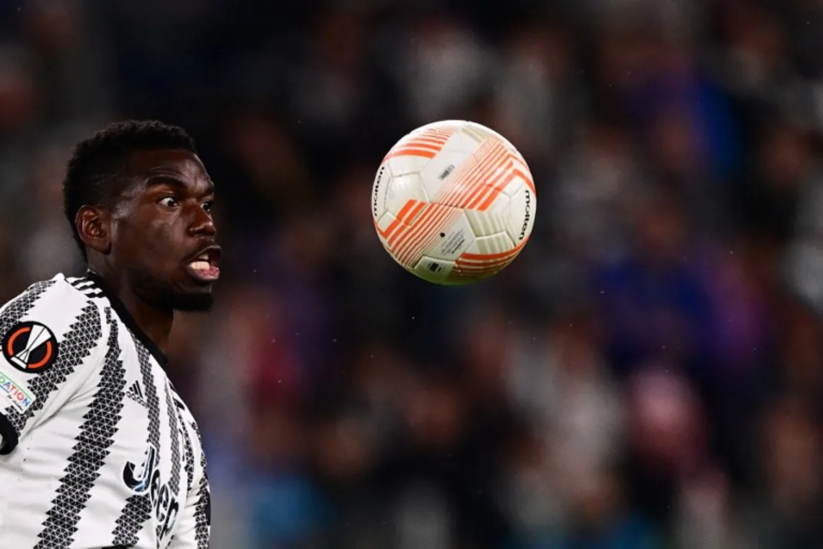 Juventus' French midfielder Paul Pogba eyes the ball during the UEFA Europa League semi-final first leg football match between Juventus and Sevilla on May 11, 2023 at the Juventus stadium in Turin.  Marco BERTORELLO / AFP