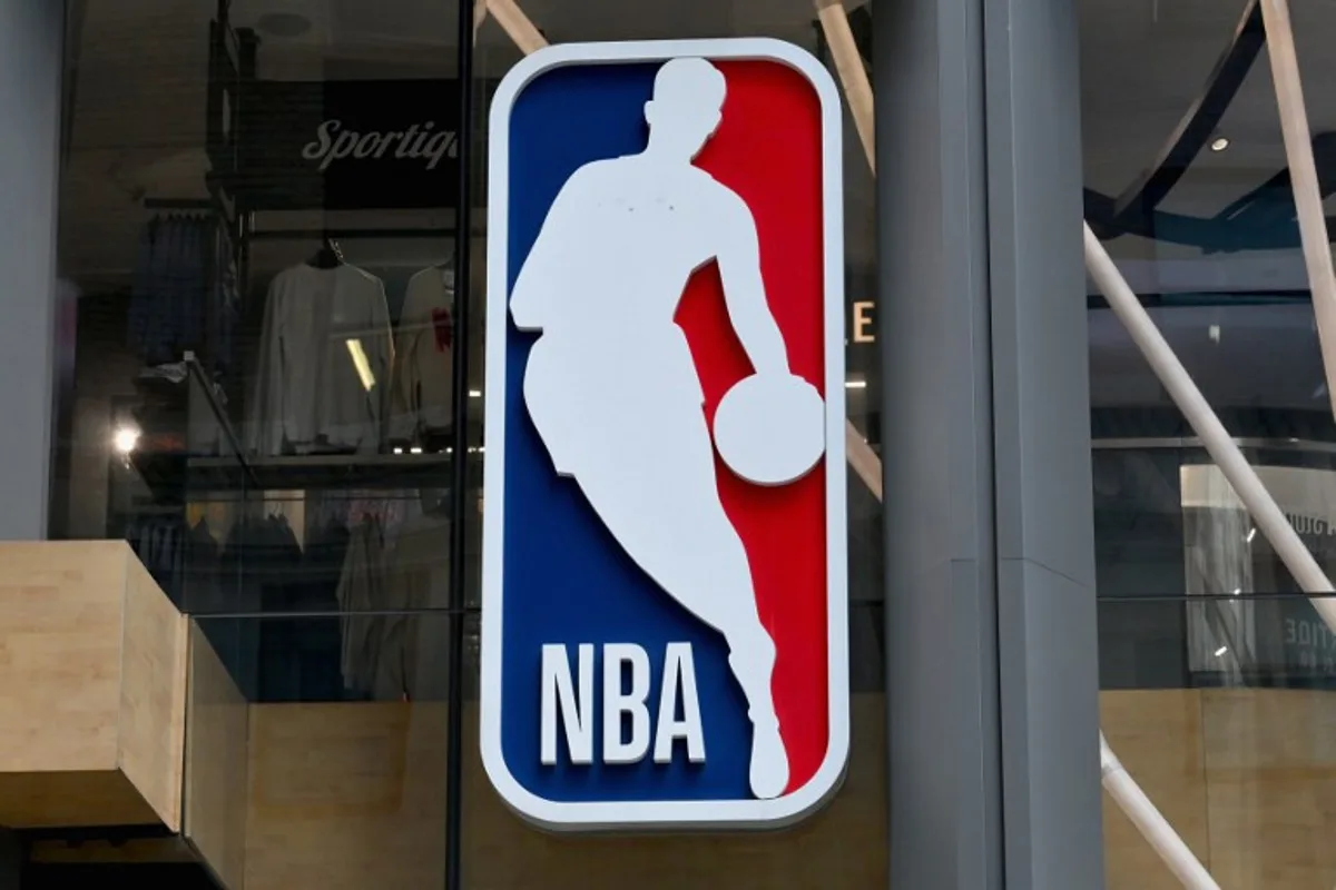 The NBA logo is seen outside an NBA fan store in New York on July 8, 2024.  ANGELA WEISS / AFP