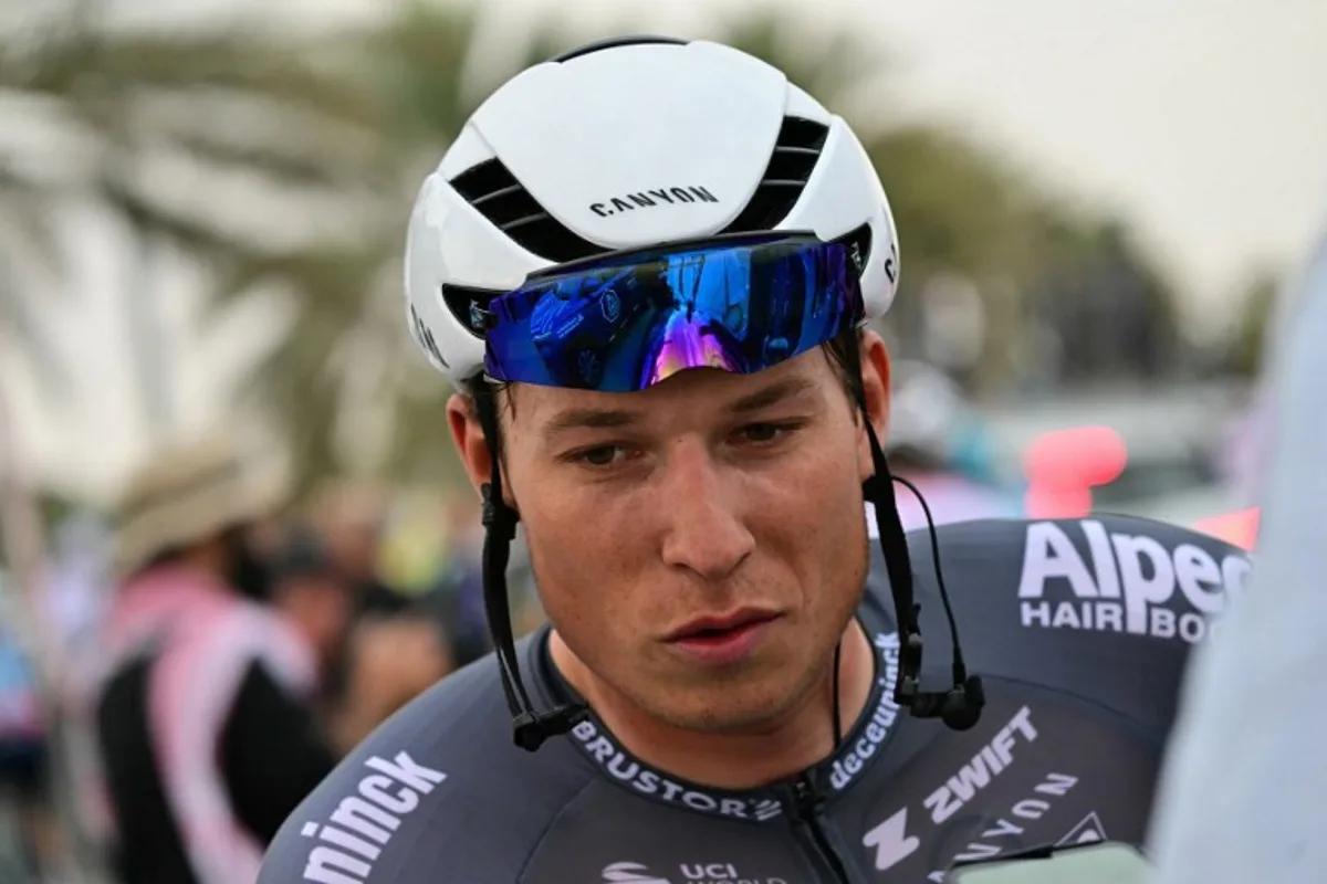 Alpecin-Deceuninck team's Belgian rider Jasper Philipsen reacts after finishing second in the first stage of the UAE Tour cycling race from Shams Solar Power Station Madinat Zayed to Liwa Palace in Abu Dhabi on February 17, 2025.  Giuseppe CACACE / AFP