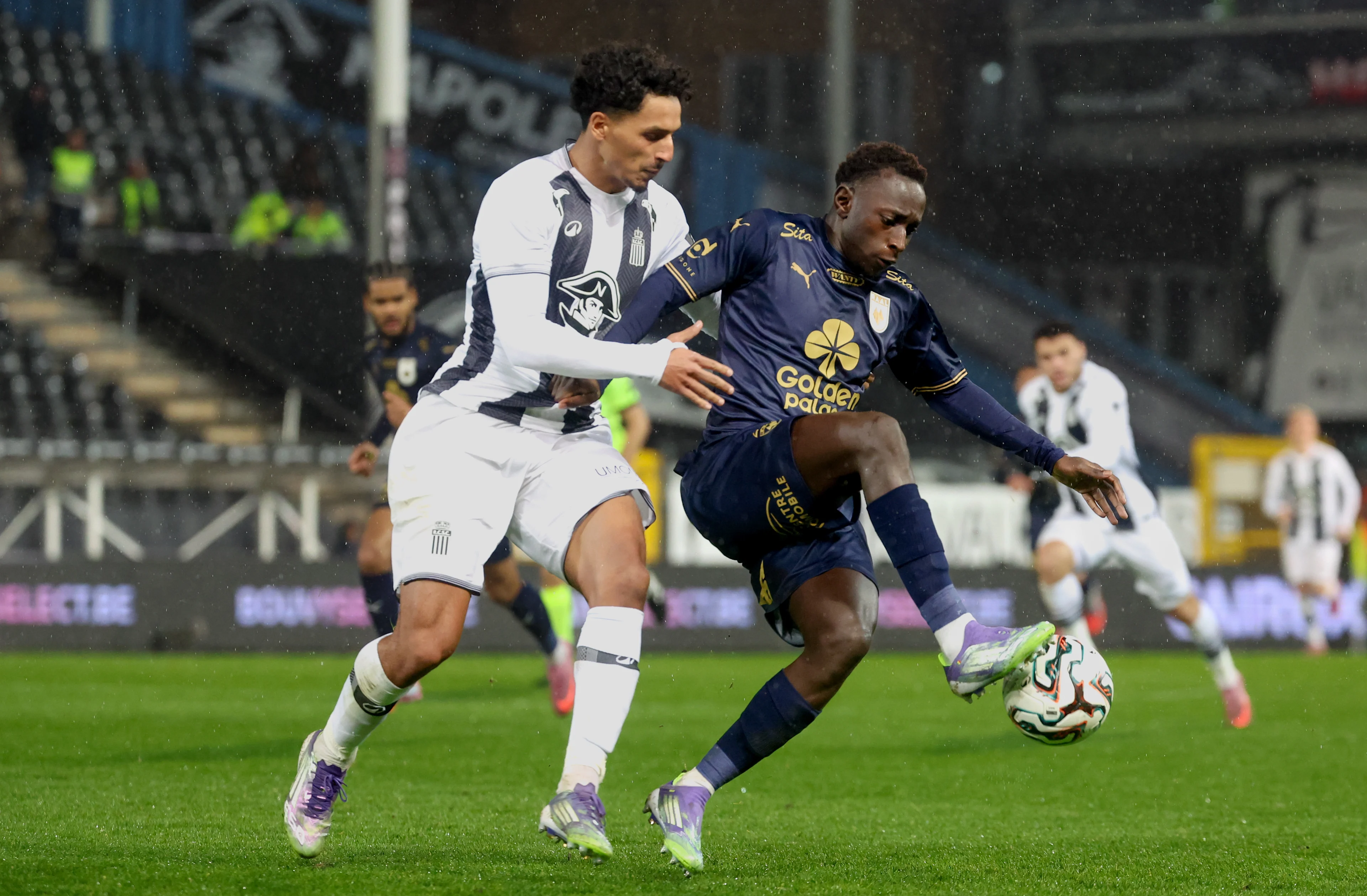 Charleroi's Mehdi Boukamir and RAAL's Oucasse Mendy fight for the ball during a soccer match between Sporting Charleroi and RAAL La Louviere, Saturday 29 November 2025 in Charleroi, on day 16 of the 2025-2026 'Jupiler Pro League' first division of the Belgian championship. BELGA PHOTO VIRGINIE LEFOUR