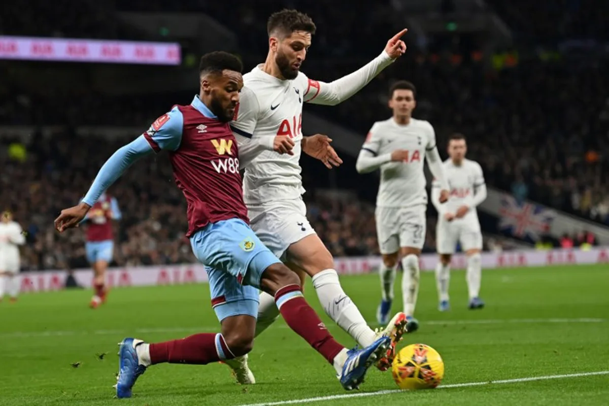 Burnley's Belgian defender #44 Hannes Piterson Delcroix (L) vies with Tottenham Hotspur's Uruguayan midfielder #30 Rodrigo Bentancur (C) during the English FA Cup third round football match between Tottenham Hotspur and Burnley at Tottenham Hotspur Stadium in London, on January 5, 2024.  Glyn KIRK / AFP