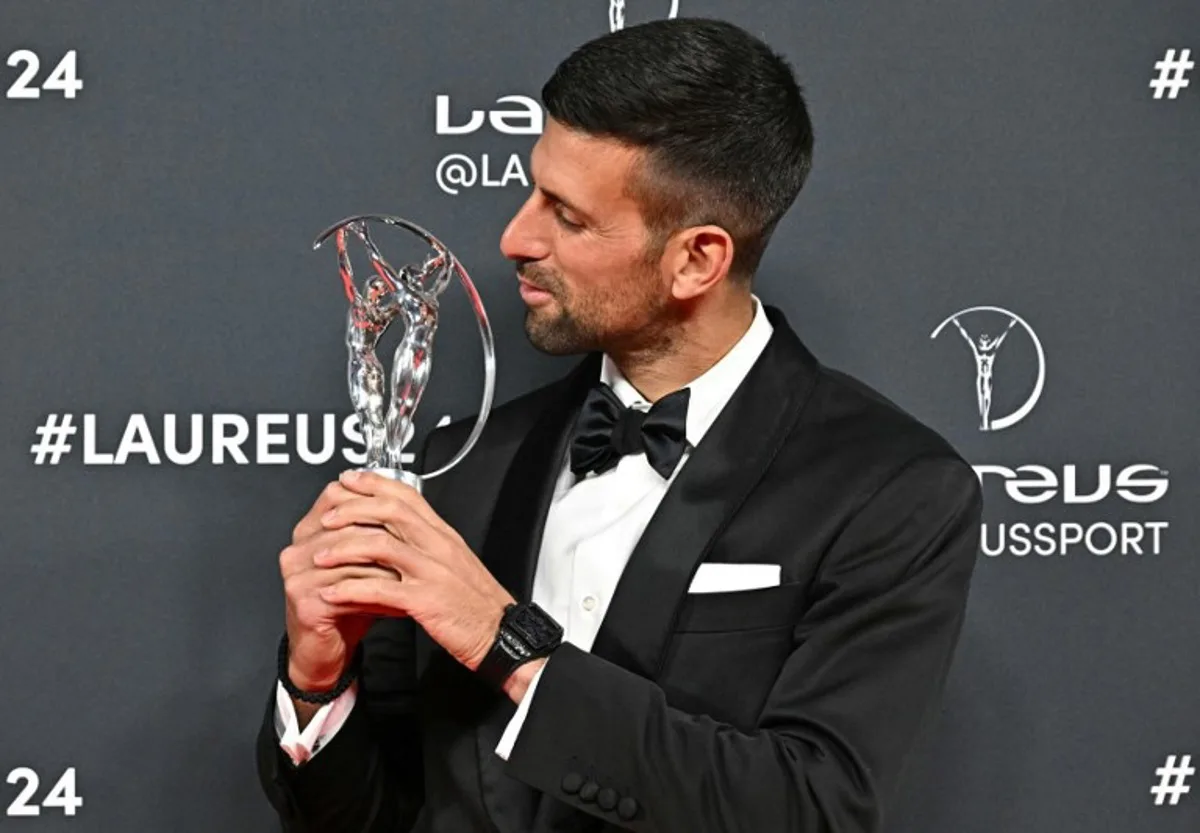 Serbian tennis player Novak Djokovic poses with the Laureus World Sportsman of the Year award during the 25th Laureus World Sports Awards gala in Madrid on April 22, 2024.  JAVIER SORIANO / AFP