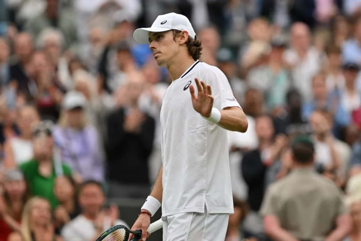 Australia's Alex De Minaur reacts after winning against France's Arthur Fils during their men's singles fourth round tennis match on the eighth day of the 2024 Wimbledon Championships at The All England Lawn Tennis and Croquet Club in Wimbledon, southwest London, on July 8, 2024. De Minaur won the match 6-2, 6-4, 4-6, 6-3. Glyn KIRK / AFP