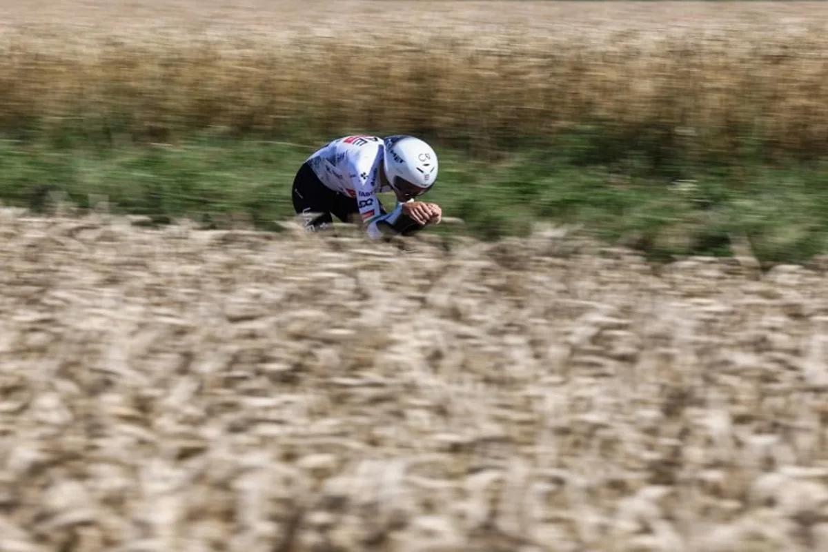 UAE Team Emirate - XRG team's Portuguese rider Joao Almeida cycles during the 5th stage of the 112th edition of the Tour de France cycling race, 33 km individual time trial starting and finishing in Caen, northwestern France, on July 9, 2025. Anne-Christine POUJOULAT / AFP