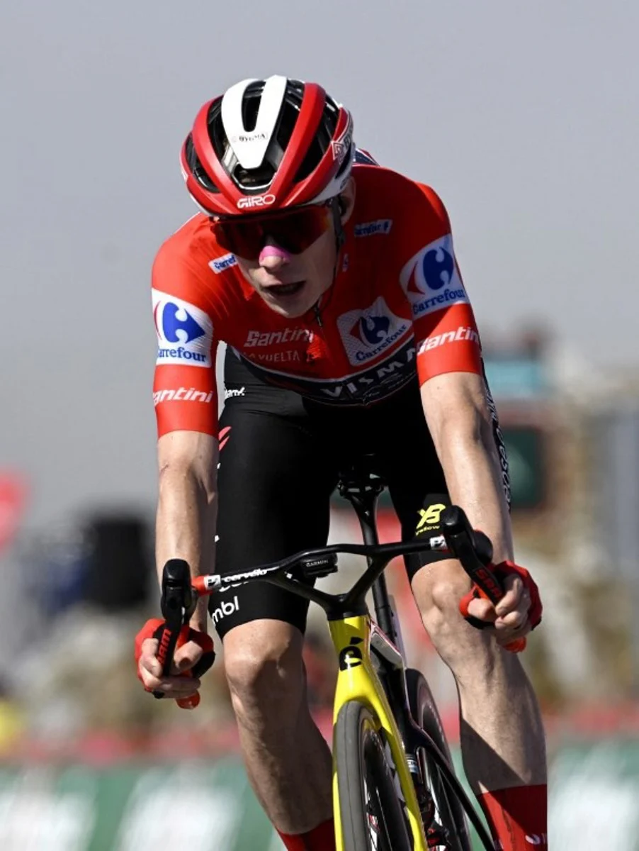 Second placed, overall leader of the Team Visma-Lease a Bike, Danish rider Jonas Vingegaard, crosses the finish line of the 13th stage of the Vuelta a Espana, a 202 km race between Cabezon de la Sal and L'Angliru, on September 5, 2025. Miguel RIOPA / AFP