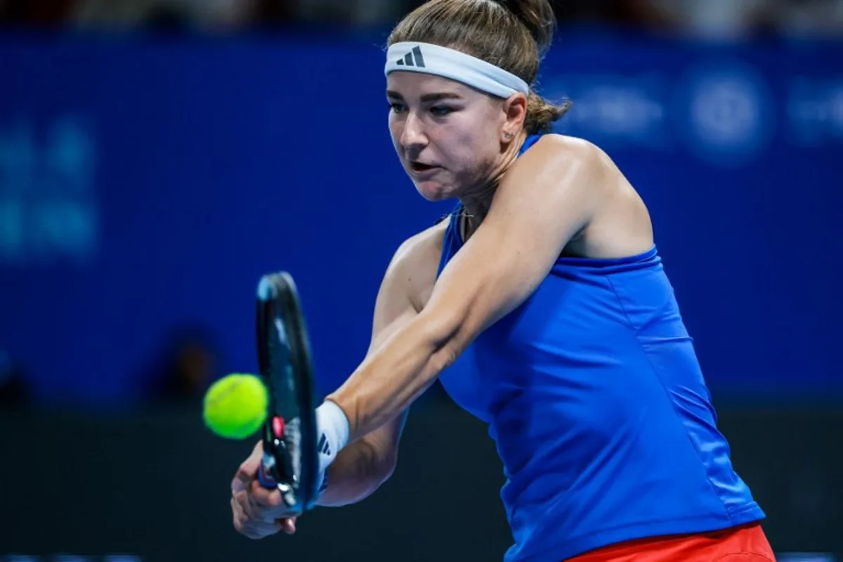 Czech Republic's Karolina Muchova hits a return to Spain's Jessica Bouzas Maneiro during their women's singles semi-final match at the Billie Jean King Cup tennis tournament in Shenzhen, in China's southern Guangdong province on September 25, 2026.   CN-STR / AFP