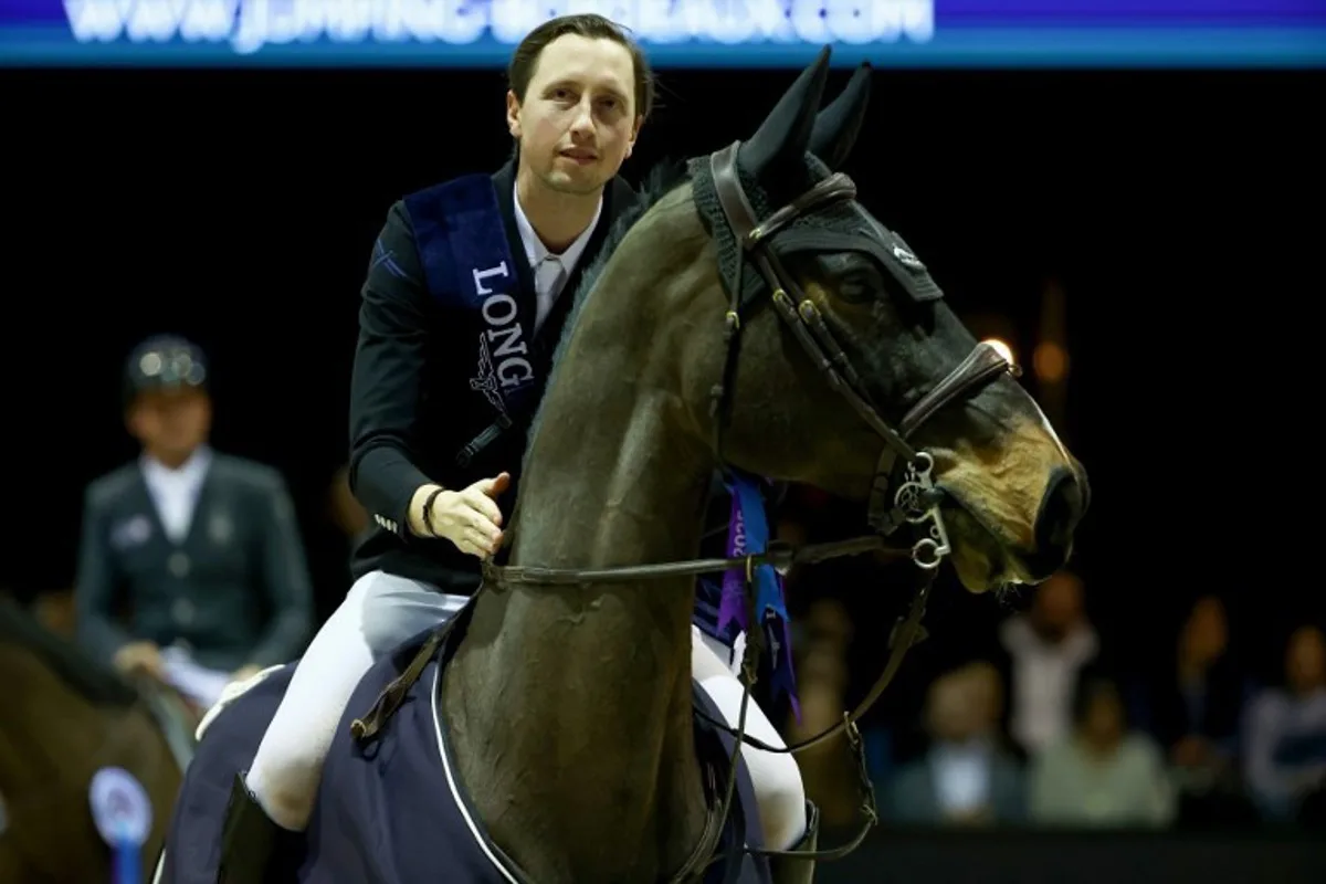Switzerland' Martin Fuchs riding Connor Jei made poses after the FEI World Cup Jumping event at the Parc des Expositions in Bordeaux, south-western France, on February 8, 2025. ROMAIN PERROCHEAU / AFP