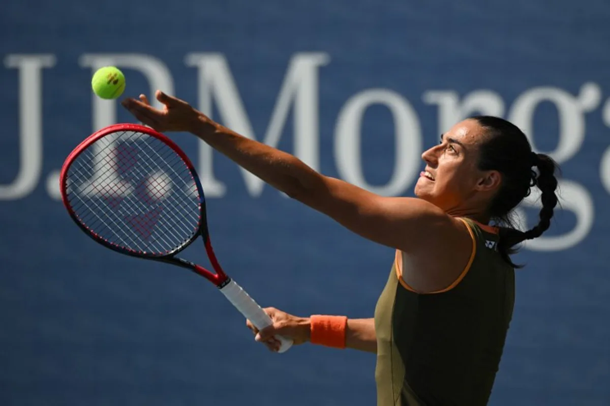 France's Caroline Garcia serves to Russia's Kamilla Rakhimova during their women's singles first round tennis match on day two of the US Open tennis tournament at the USTA Billie Jean King National Tennis Center in New York City, on August 25, 2025. ANGELA WEISS / AFP