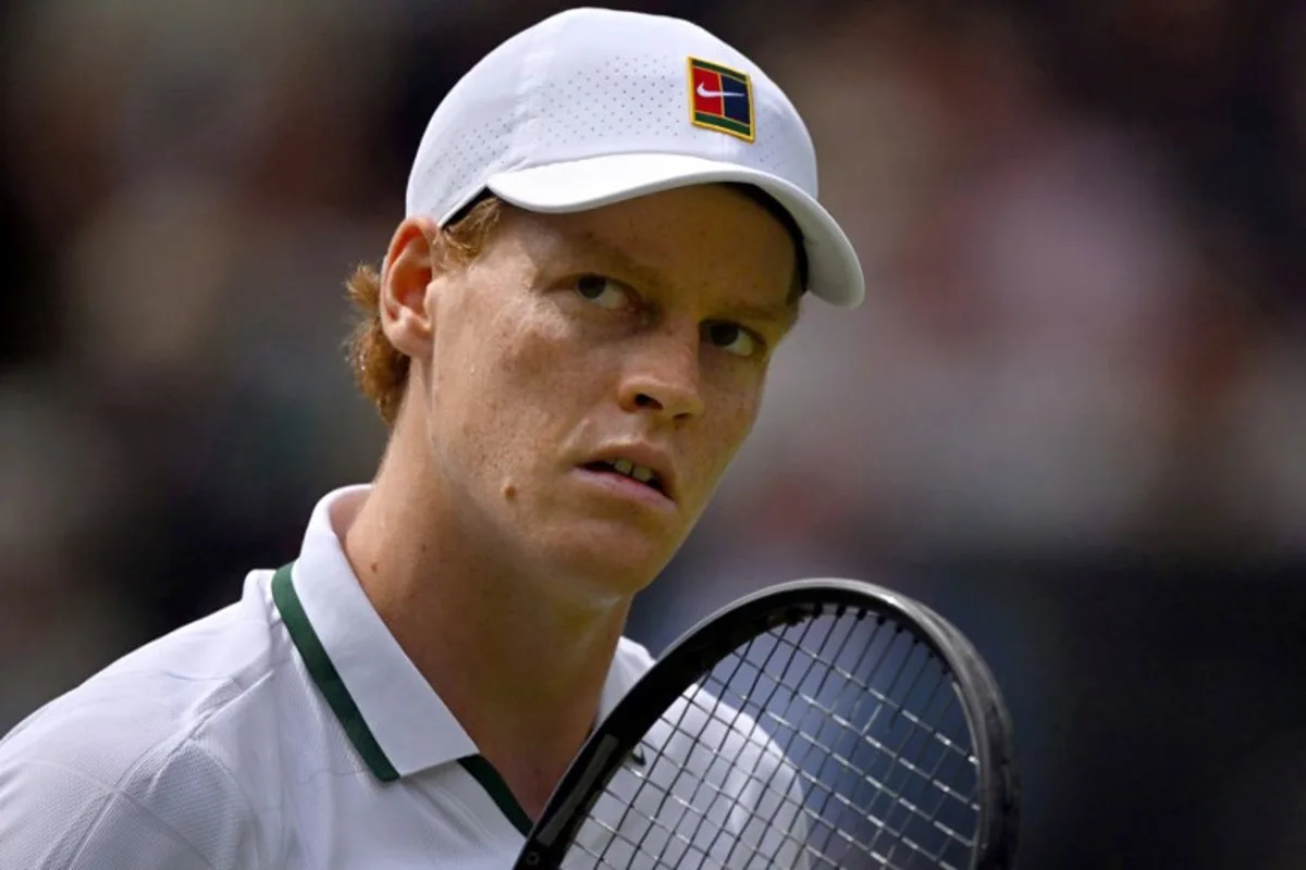 Italy's Jannik Sinner reacts as he plays against Serbia's Miomir Kecmanovic during their men's singles first round tennis match on the first day of the 2026 Wimbledon Championships at The All England Lawn Tennis and Croquet Club in Wimbledon, southwest London, on June 29, 2026.  Glyn KIRK / AFP