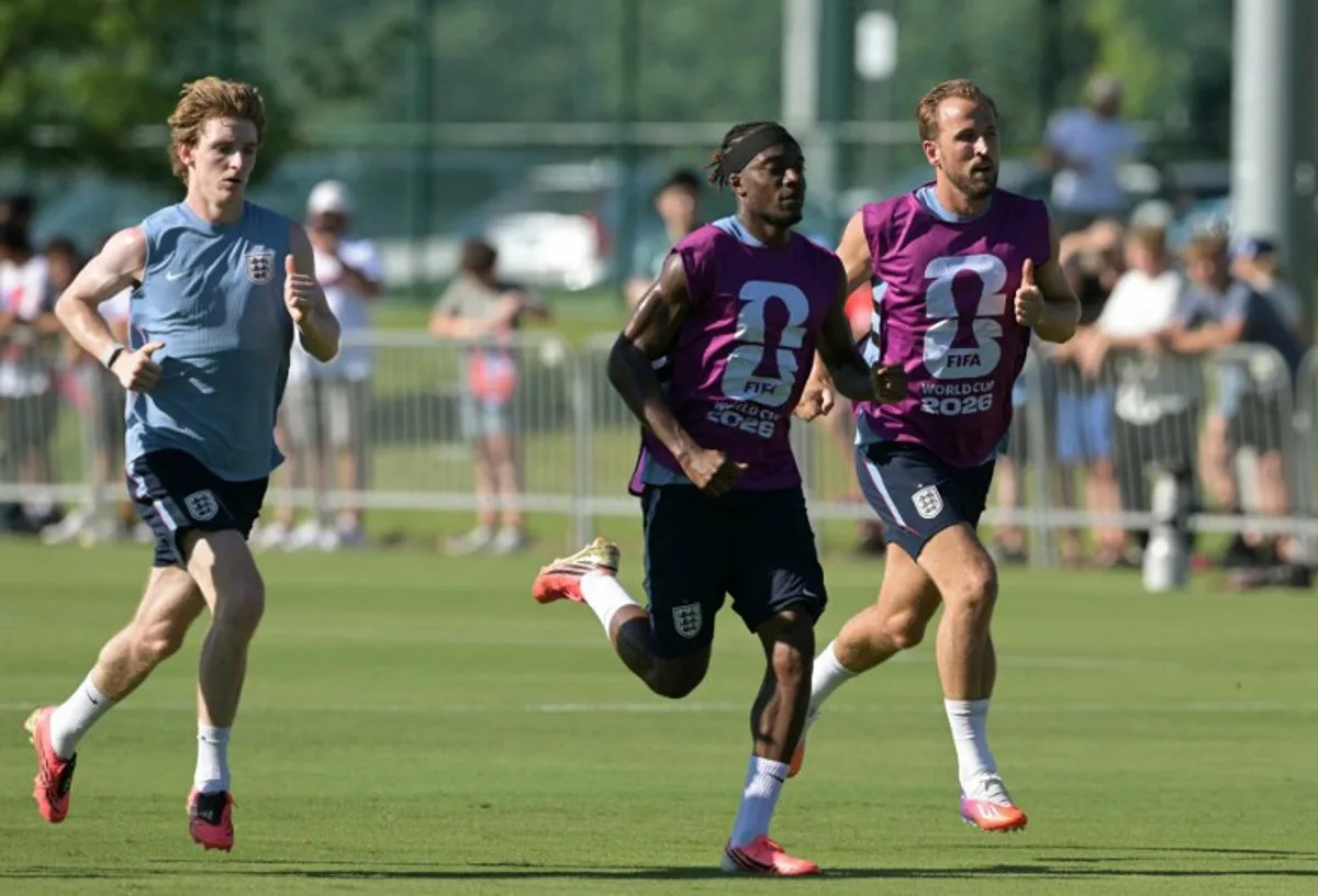 (From L) England's forward #18 Anthony Gordon, England's forward #20 Noni Madueke and England's forward #09 Harry Kane take part in a training session ahead of England's 2026 World Cup football tournament Group L football match against Croatia at Swope Soccer Village in Kansas City on June 13, 2026.   JUAN MABROMATA / AFP