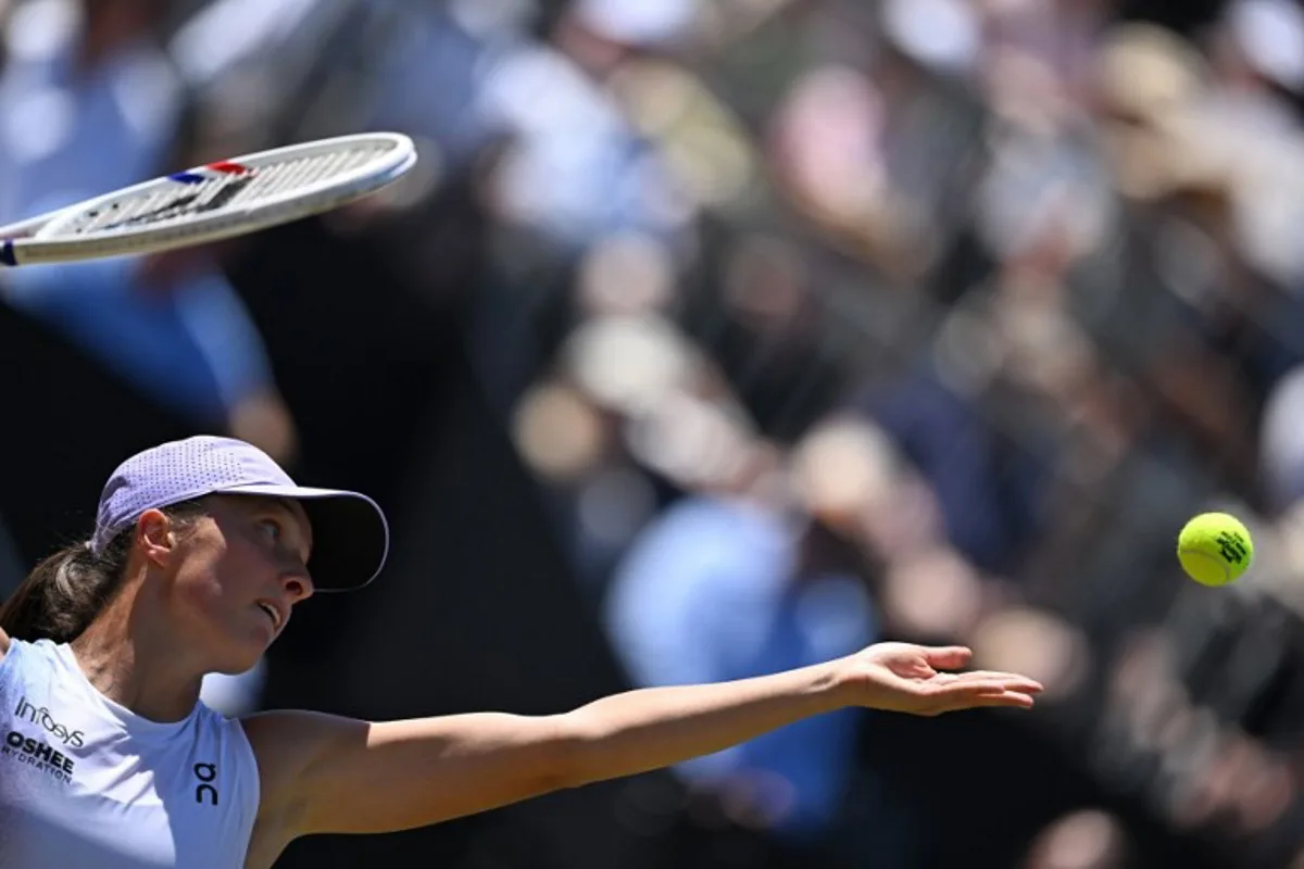 Poland's Iga Swiatek serves the ball to USA's Jessica Pegula (not pictured) during their final match of the 2025 WTA Bad Homburg Open Tennis Tournament on June 28, 2025 in Bad Homburg, western Germany. Kirill KUDRYAVTSEV / AFP