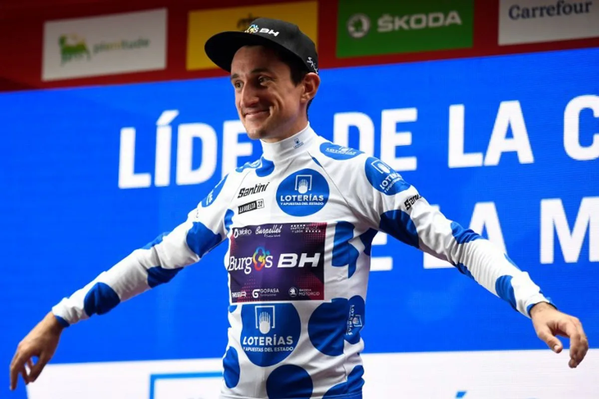 Team Burgos - BH's Monegasque rider Victor Langelotti celebrates on the podium wearing the best climber's jersey after the 5th stage of the 2022 La Vuelta cycling tour of Spain, a 187.2 km race from Irun to Bilbao, on August 24, 2022. ANDER GILLENEA / AFP