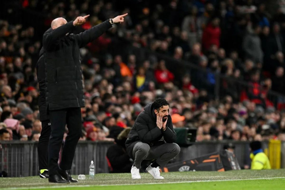 Manchester United's Portuguese head coach Ruben Amorim (R) reacts next to Rangers Belgian manager Philippe Clement during the UEFA Europa league football match between Manchester United and Glasgow Rangers at Old Trafford stadium in Manchester, north west England, on January 23, 2025.  Oli SCARFF / AFP