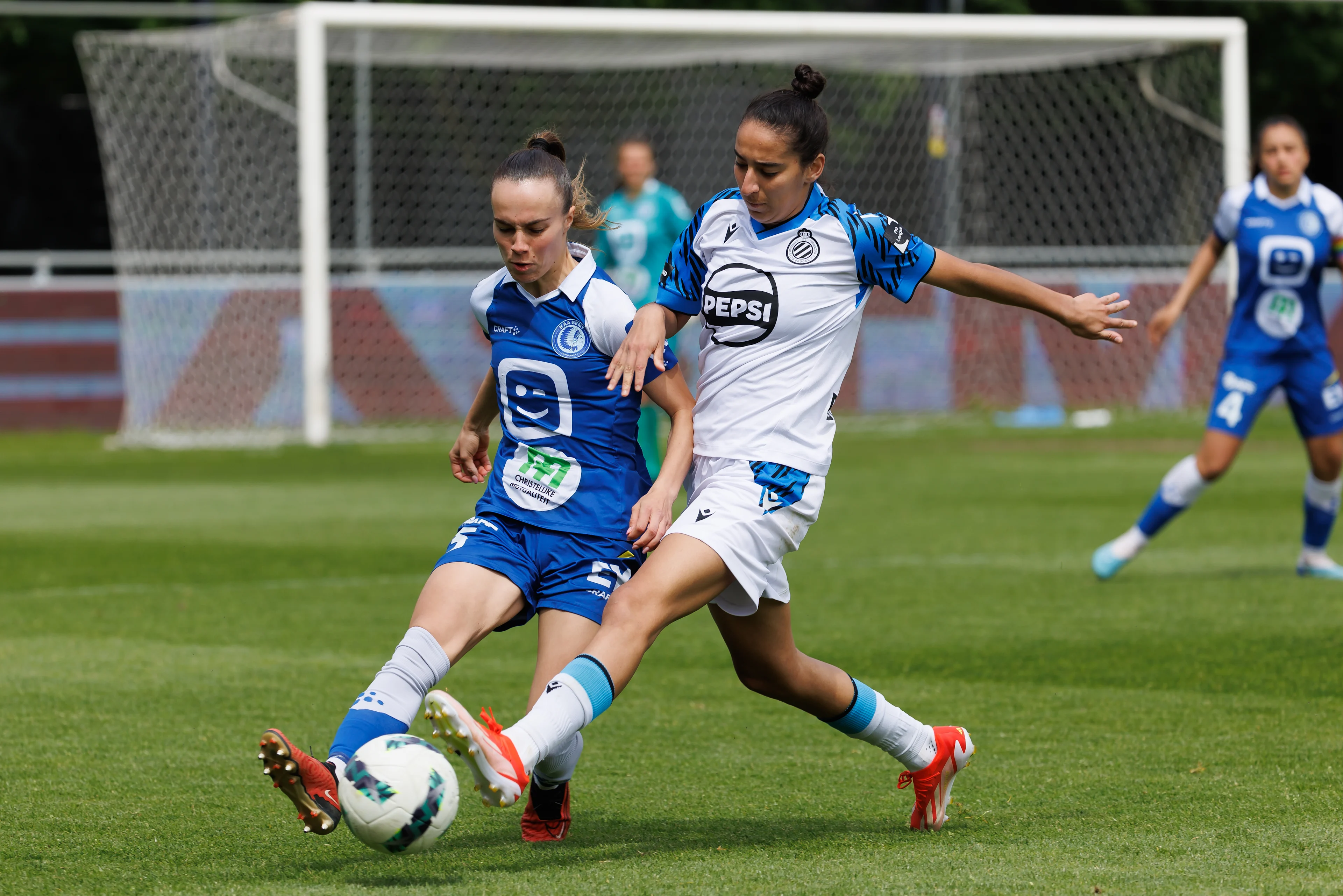 Kaa Gent Ladies's Silke Speeckaert and YLA's Rania Boutiebi fight for the ball during a soccer game between KAA Gent Ladies and Club YLA, Saturday 04 May 2024 at the Chillax Arena in Gent, on day 7 of the play-off group A of the Super League women's competition. BELGA PHOTO KURT DESPLENTER