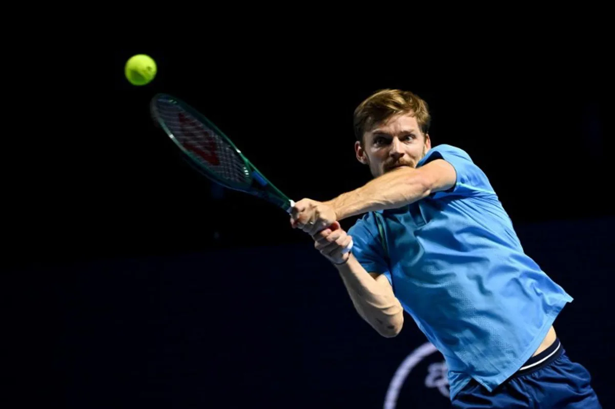 Belgium's David Goffin hits a return to Denmark's Holger Rune during their men's singles quarter-final match at the Swiss Indoors ATP 500 tennis tournament in Basel on October 25, 2024.  Fabrice COFFRINI / AFP