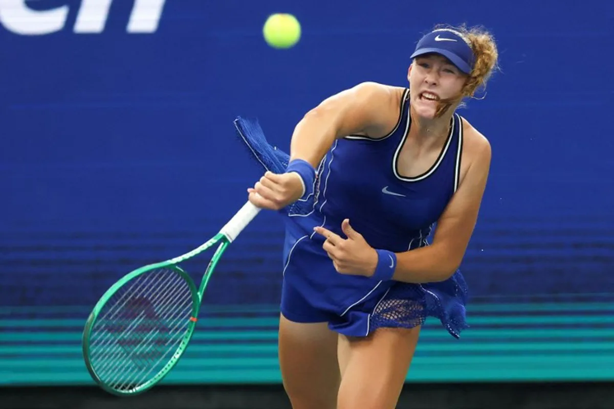 Russia's Mirra Andreeva follows through on a serve to Indonesia's Janice Tjen during their women's singles first round tennis match on day three of the US Open tennis tournament at the USTA Billie Jean King National Tennis Center in New York City on September 1, 2026. TIMOTHY A. CLARY / AFP