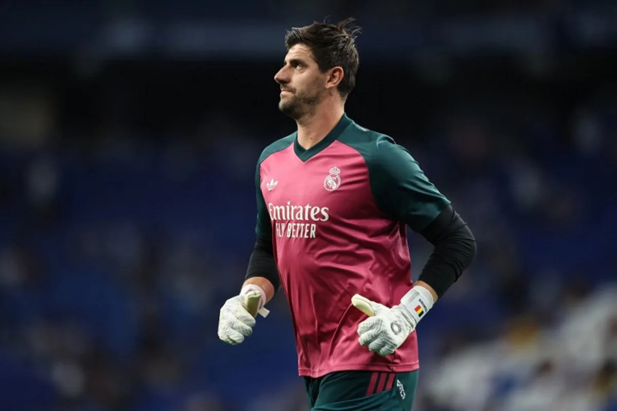 Real Madrid's Belgian goalkeeper #01 Thibaut Courtois warms up before the Spanish league football match between RCD Espanyol and Real Madrid CF at RCDE Stadium in Cornella de Llobregat on August 22, 2026. Josep LAGO / AFP