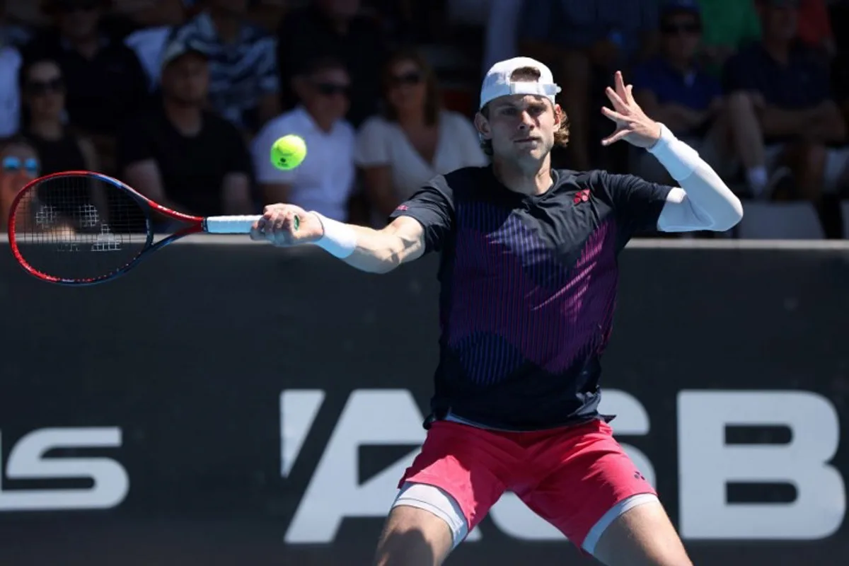 Zizou Berges of Belgium hits a return to Gael Monfils of France during their men's singles final match at the ATP Auckland Classic tennis tournament in Auckland on January 11, 2025.  Michael Bradley / AFP