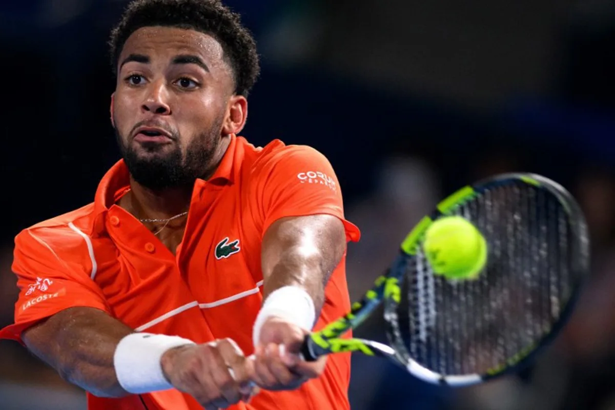 France's Arthur Fils hits a return against USA's Ben Shelton during their men's singles quarter-final match on the fifth day of the ATP Japan Open tennis tournament in Tokyo on September 29, 2024.  Philip FONG / AFP