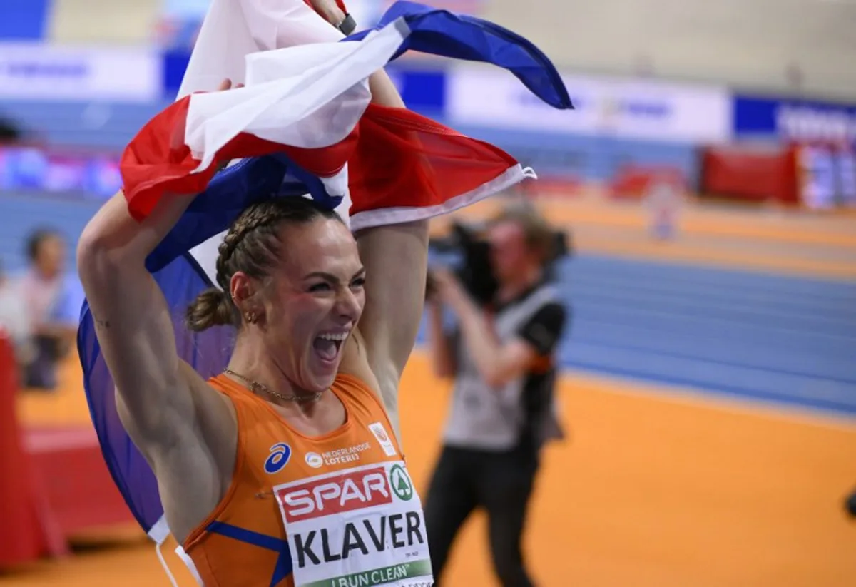 Netherlands' Lieke Klaver celebrates after winning the women 400m final of the European Athletics Indoor Championships at Omnisport in Apeldoorn on March 8, 2025.  JOHN THYS / AFP