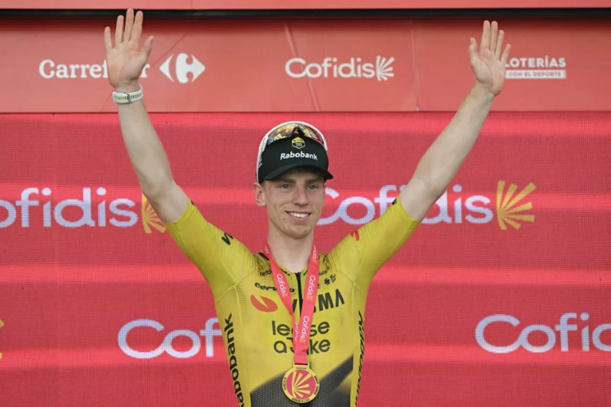 Team Visma-Lease a bike's British rider Matthew Brennan celebrates on the podium after winning the 17th stage of the Vuelta a Espana 2026 cycling tour, a 185 km race between Dos Hermanas and Seville, on September 9, 2026.   JORGE GUERRERO / AFP
