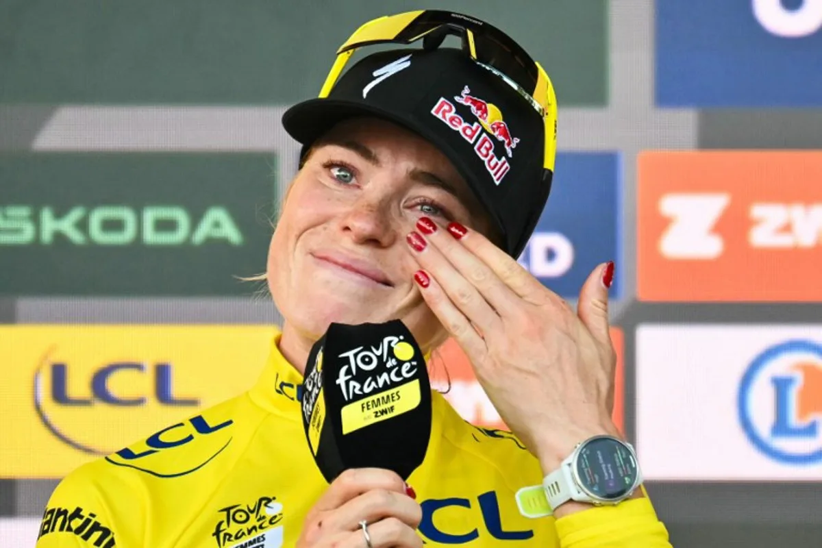 FDJ-SUEZ's Dutch rider Demi Vollering reacts on the podium after winning the 9th and final stage of the fifth edition of the Women's Tour de France cycling race, 99.2 km from Nice to Nice, southeastern France on August 9, 2026. NICOLAS TUCAT / AFP