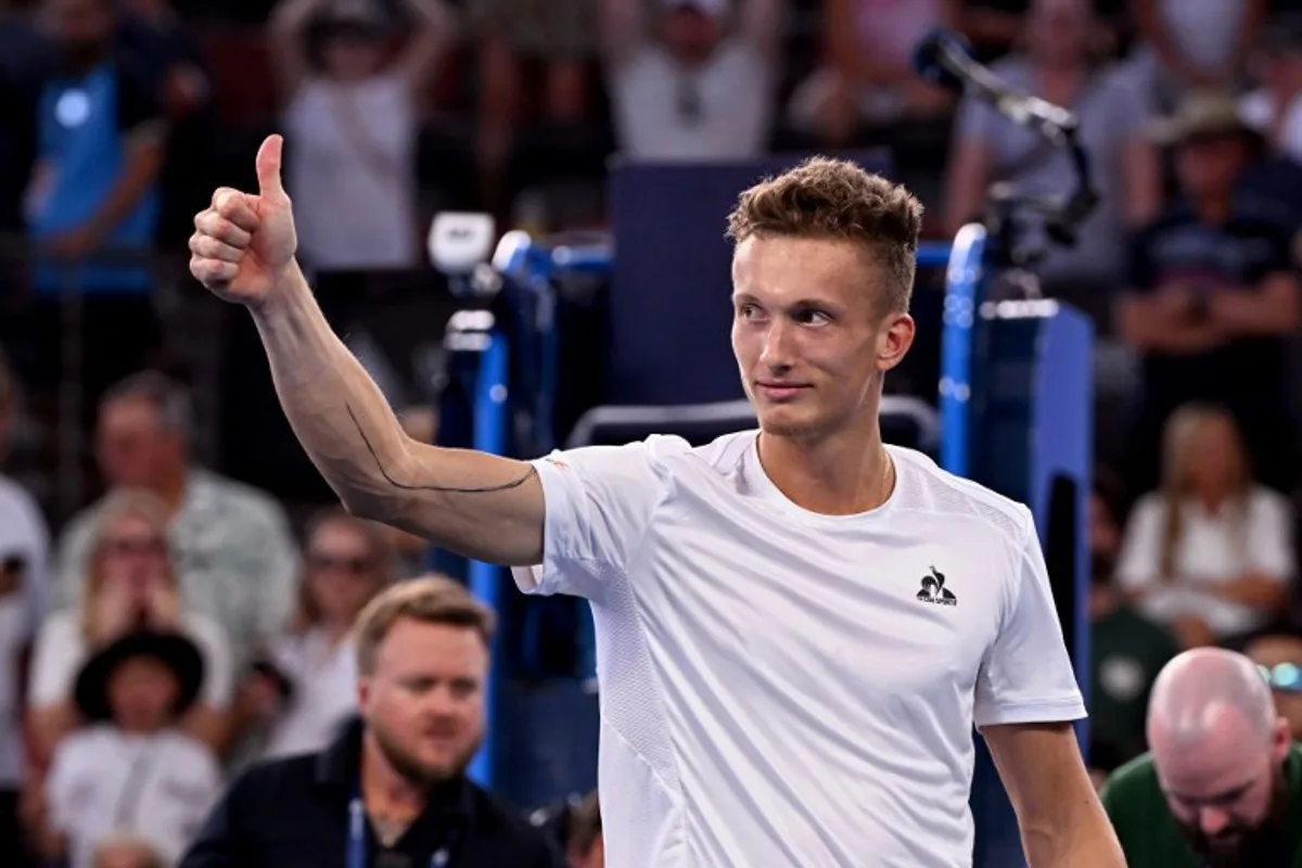 Jiri Lehecka of the Czech Republic celebrates after winning the men's singles semi-final match against Grigor Dimitrov of Bulgaria at the Brisbane International tennis tournament in Brisbane on January 4, 2025.  William WEST / AFP