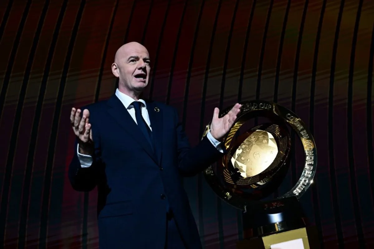 President of FIFA Gianni Infantino speaks next to the trophy during the 2025 FIFA Club World Cup Draw ceremony in Miami on December 5, 2024.  Giorgio VIERA / AFP