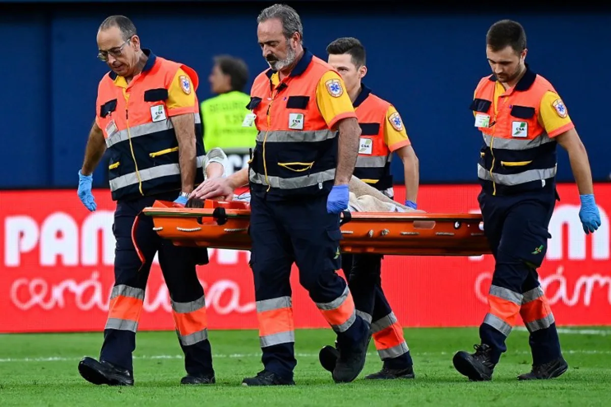 Barcelona's German goalkeeper #01 Marc-Andre Ter Stegen is escorted off-pitch on a stretcher during the Spanish league football match between Villarreal CF and FC Barcelona at La Ceramica stadium in Vila-real, on September 22, 2024.  JOSE JORDAN / AFP