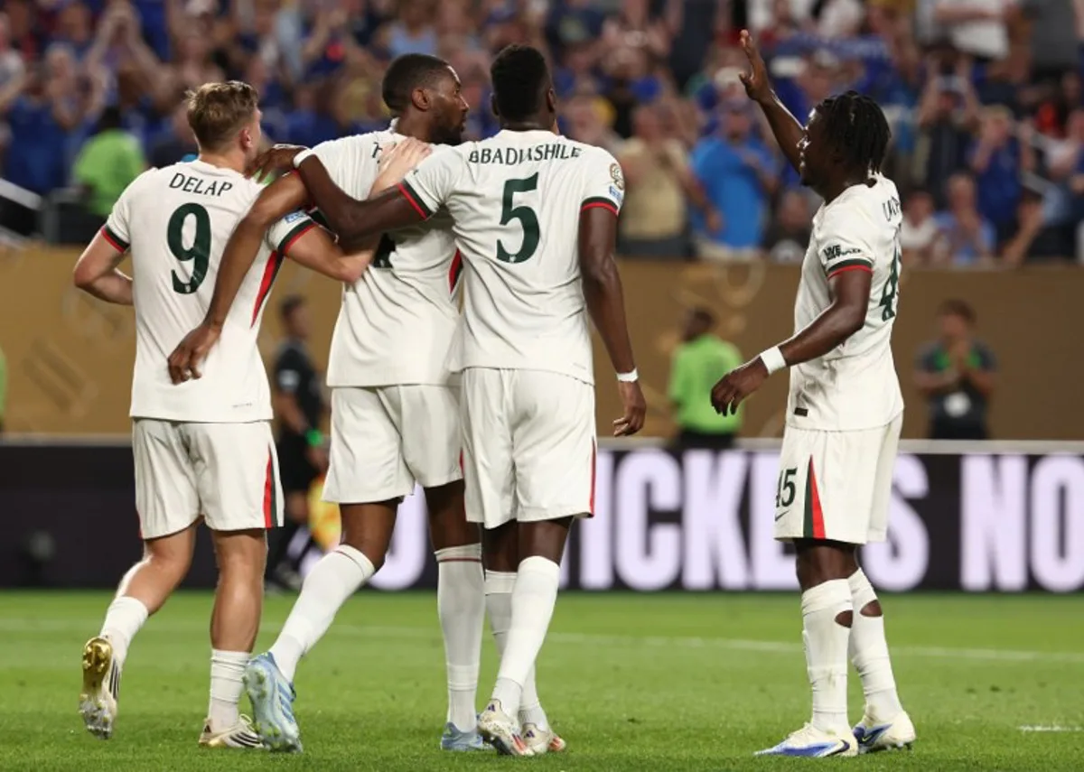 Chelsea's English defender #04 Tosin Adarabioyo (2nd L) celebrates after scoring the opening goal with teammates forward #09 Liam Delap, French defender #05 Benoit Badiashile and Belgian midfielder #45 Romeo Lavia during the FIFA Club World Cup 2025 Group D football match between Tunis' Esperance Sportive de Tunis and England's Chelsea at the Lincoln Financial Field stadium in Philadelphia on June 24, 2025. FRANCK FIFE / AFP