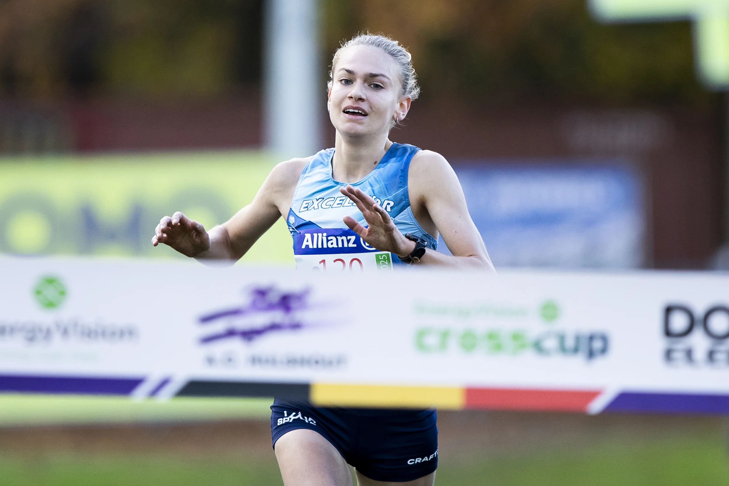 Belgian Jana Van Lent celebrates as she crosses the finish line to win the women elite race of the CrossCup cross country running athletics event in Hulshout, the third stage of the CrossCup competition and the Belgian Championships, Sunday 17 November 2024. BELGA PHOTO KRISTOF VAN ACCOM