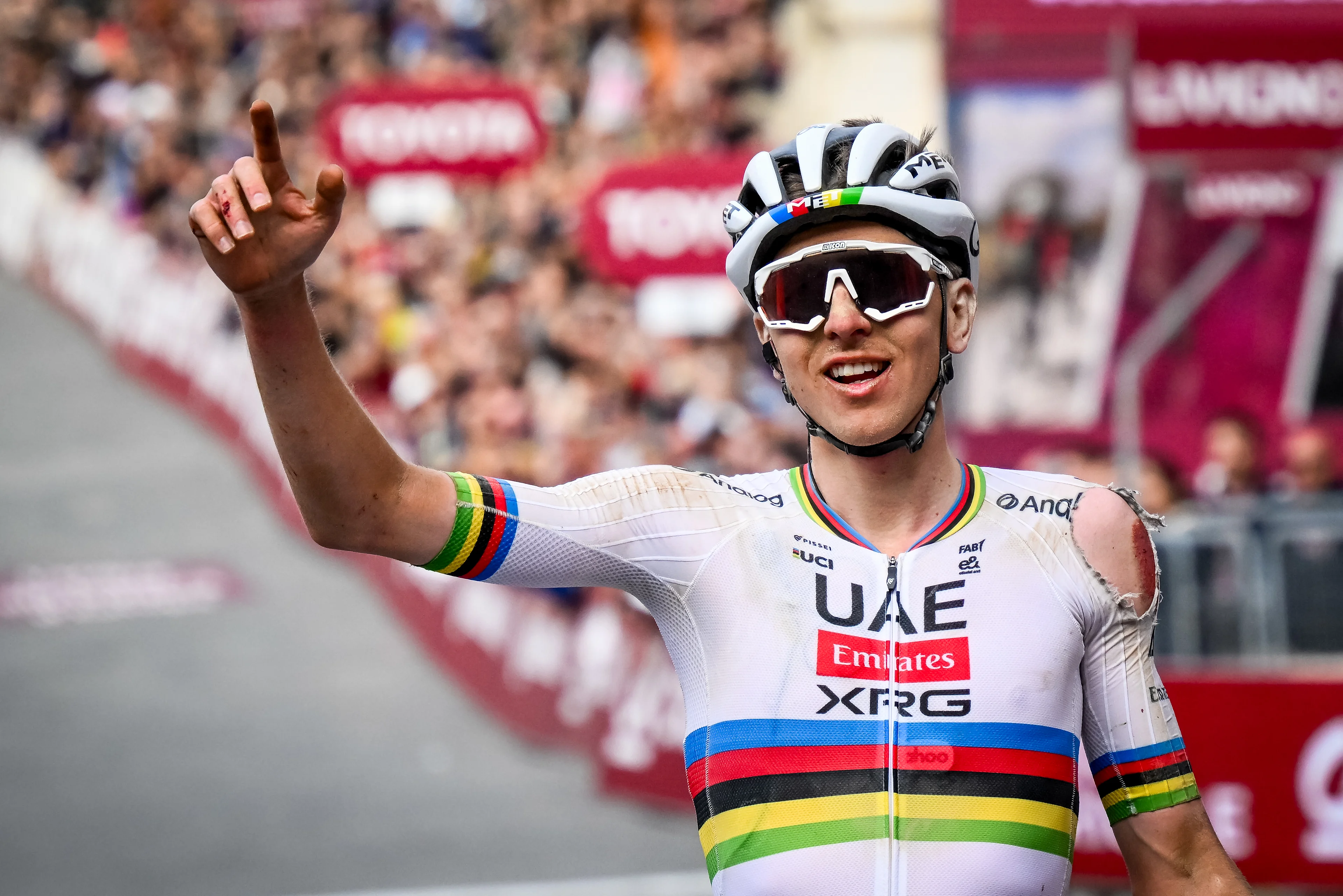 Slovenian Tadej Pogacar of UAE Team Emirates celebrates as he crosses the finish line to win the men elite 'Strade Bianche' one day cycling race, 213km from and to Siena, Italy on Saturday 08 March 2025. BELGA PHOTO DIRK WAEM