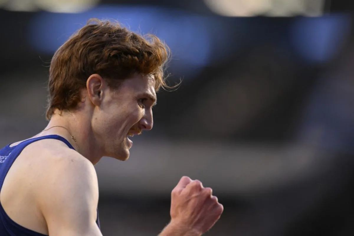 Luxembourg's Ruben Querinjean celebrates after winning the Men's 3000m Steeplechase event of the Diamond League athletics meeting at the King Baudouin Stadium in Brussels on August 22, 2025. JOHN THYS / AFP