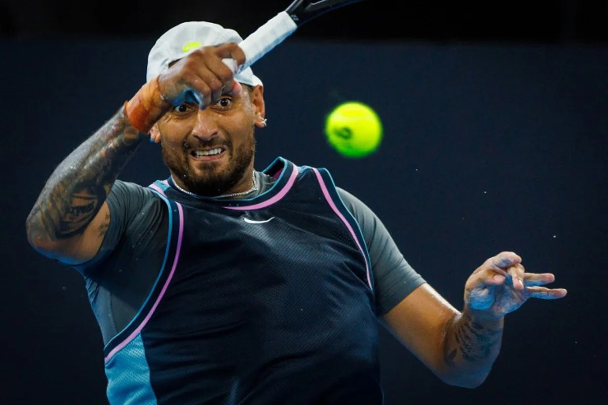 Australia's Nick Kyrgios hits a return against France's Giovanni Mpetshi Perricard during their men's singles match at the Brisbane International tennis tournament in Brisbane on December 31, 2024.  Patrick HAMILTON / AFP