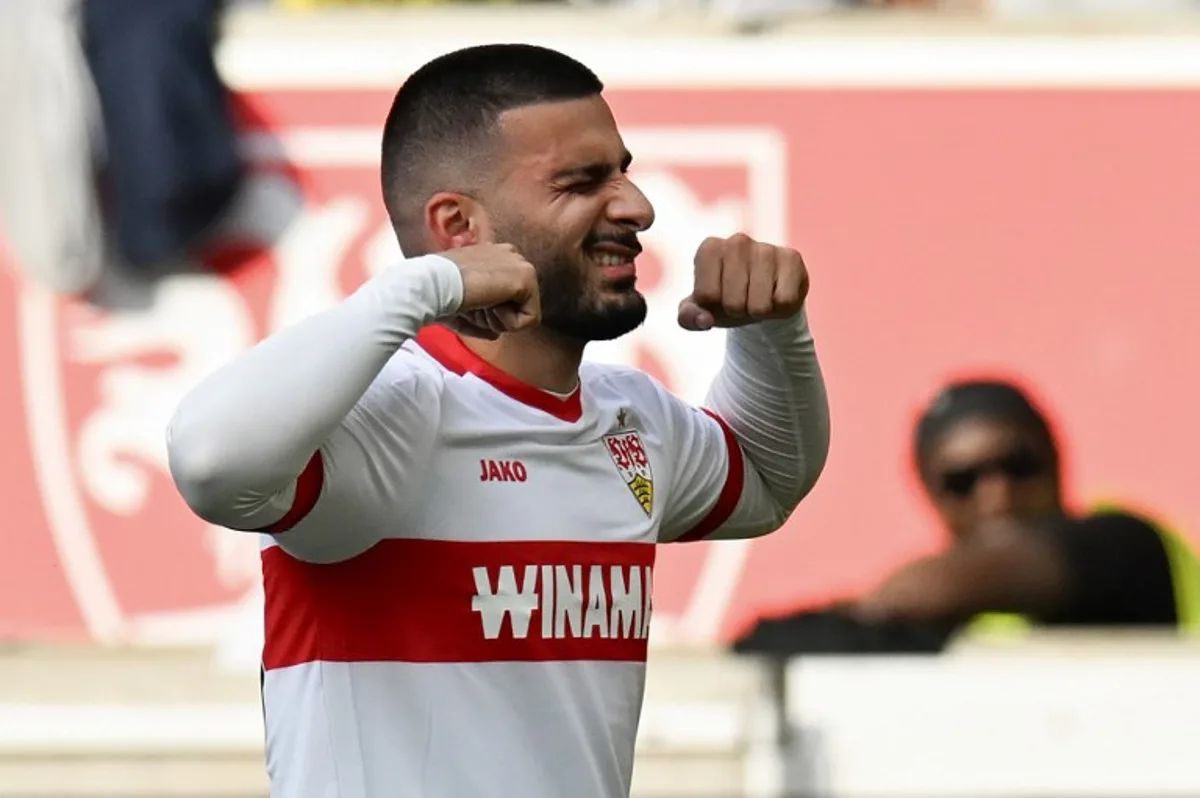 Stuttgart's German forward #26 Deniz Undav celebrates after scoring a goal during the German first division Bundesliga football match between VfB Stuttgart and Borussia Dortmund in Stuttgart, southwestern Germany on September 22, 2024.  THOMAS KIENZLE / AFP