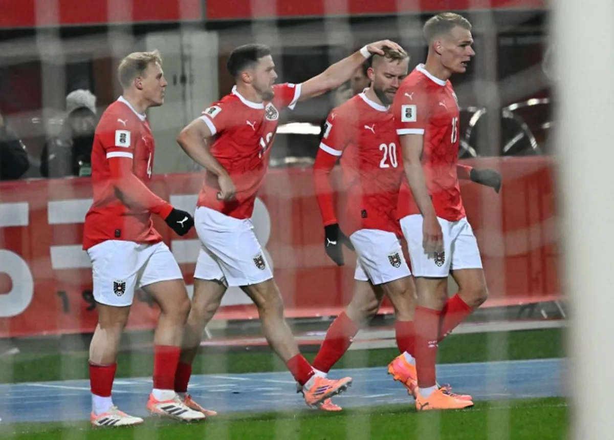 Austria's midfielder #20 Konrad Laimer (2R) celebrates with teammates scoring his team's first goal that was disallowed after during the FIFA World Cup 2026 European qualification Group H football match between Austria and Bosnia and Herzegovina, in Vienna on November 18, 2025.  Joe Klamar / AFP