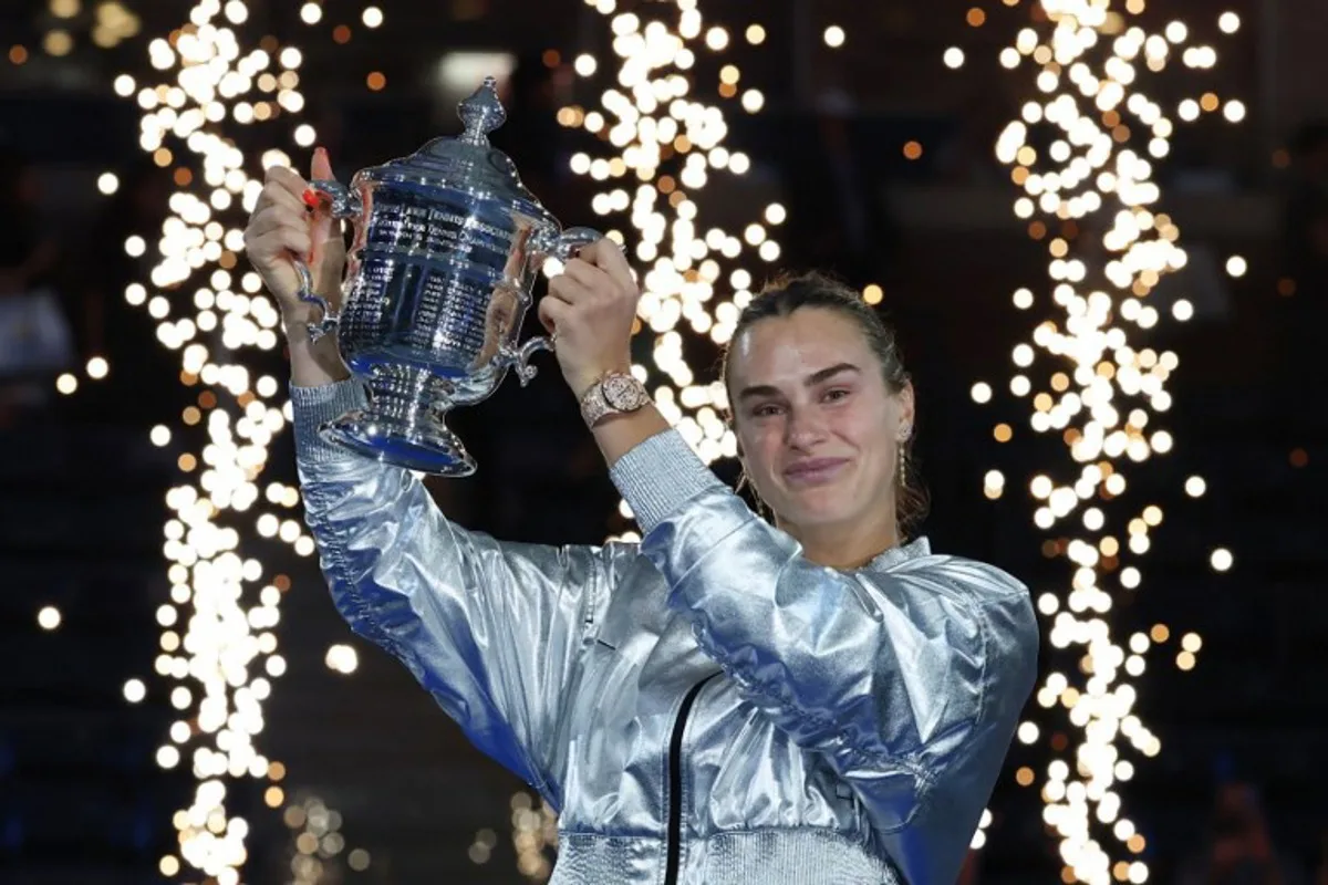 Belarus's Aryna Sabalenka poses with the trophy after defeating USA's Amanda Anisimova during their women's singles final tennis match on day fourteen of the US Open tennis tournament at the USTA Billie Jean King National Tennis Center in New York City, on September 6, 2025. TIMOTHY A.CLARY / AFP
