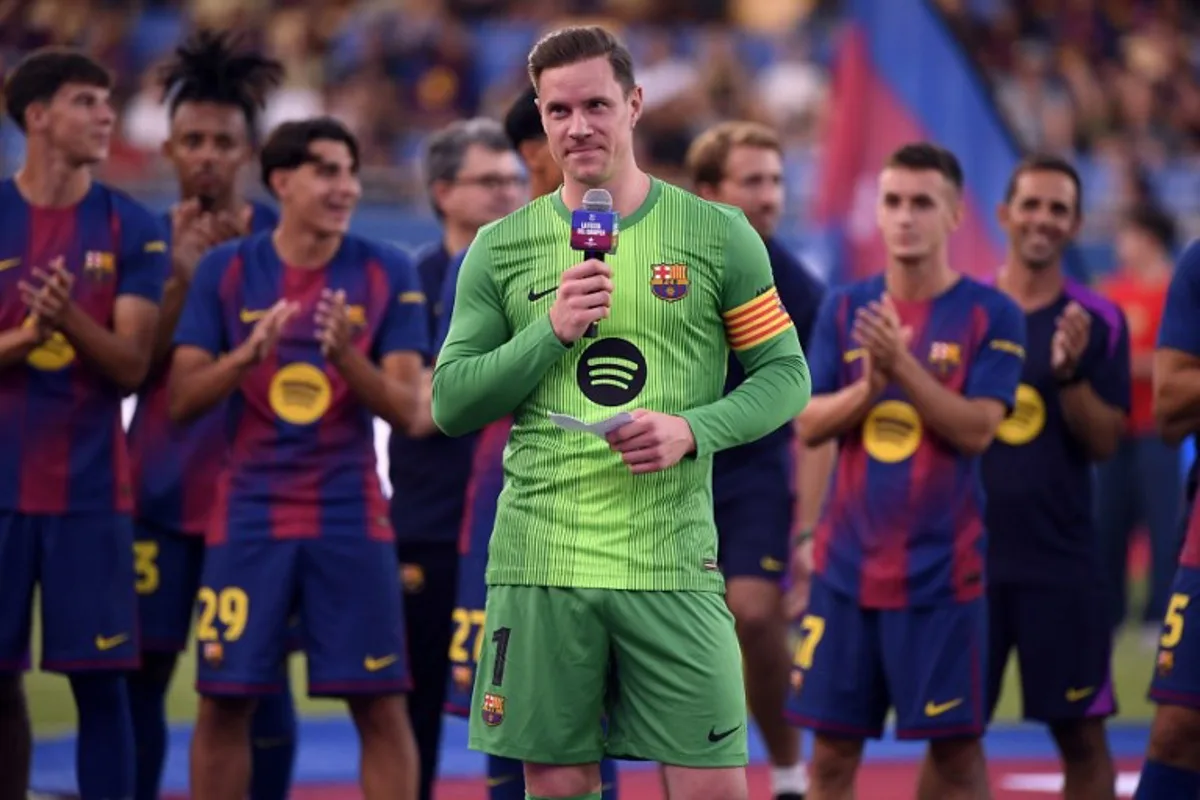 Barcelona's German goalkeeper Marc-Andre Ter Stegen delivers a speech before the 60th Joan Gamper Trophy football match between FC Barcelona and Como 1907 at Johan Cruyff Stadium in Barcelona on August 10, 2025. Josep LAGO / AFP