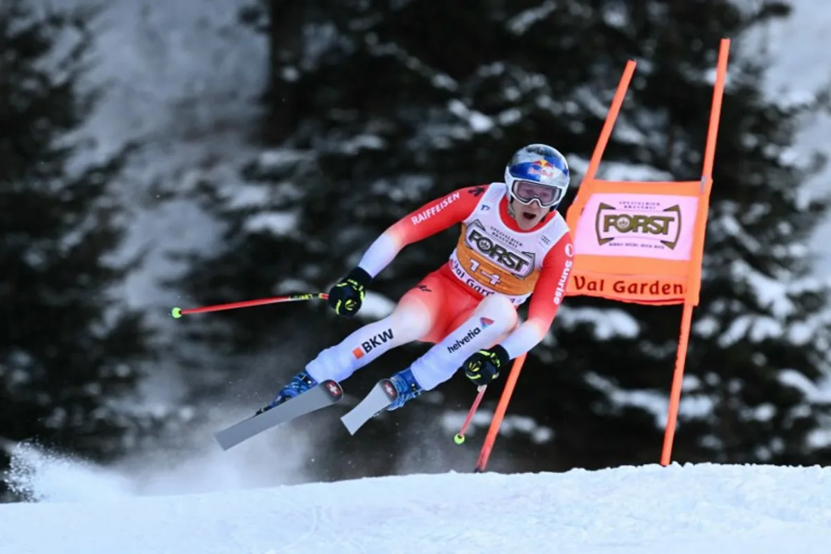 Switzerland's Marco Odermatt competes in the Men's Downhill race as part of the FIS Alpine ski World Cup 2024-2025, in Val Gardena on December 21, 2024.  Marco BERTORELLO / AFP