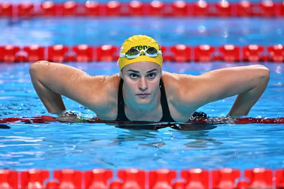 Australia's swimmer Kaylee McKeown reacts after competing in a semi-final of the women's 200m backstroke swimming event during the 2025 World Aquatics Championships in Singapore on August 1, 2025. MANAN VATSYAYANA / AFP