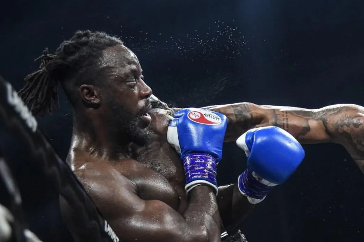 France's Tony Yoka (R) throws a jab at Belgium's Joel Tambwe Djeko during their EBU European Union heavyweight title boxing match at the H Arena in Nantes, western France, on March 5, 2021. JEAN-FRANCOIS MONIER / AFP