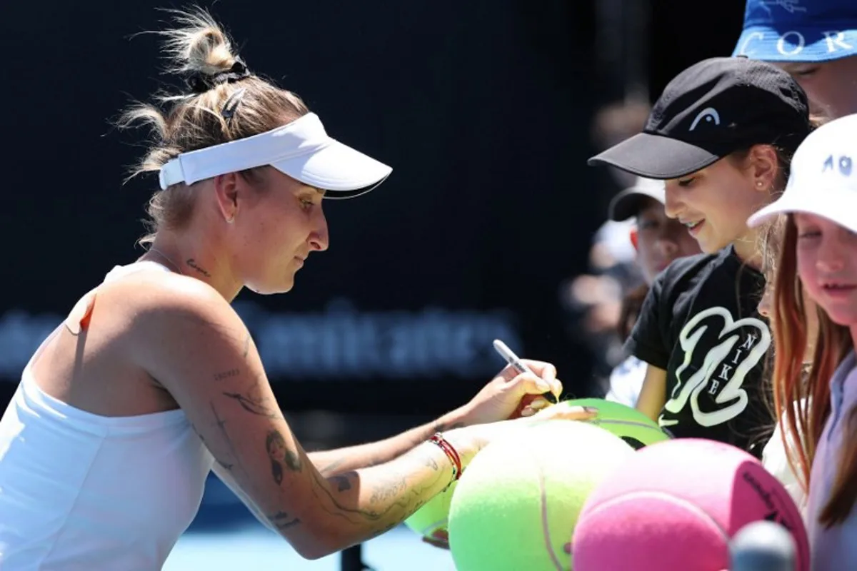 Czech Republic's Marketa Vondrousova signs autographs during a practice session ahead of the 2026 Australian Open tennis tournament in Melbourne on January 17, 2026. Martin KEEP / AFP