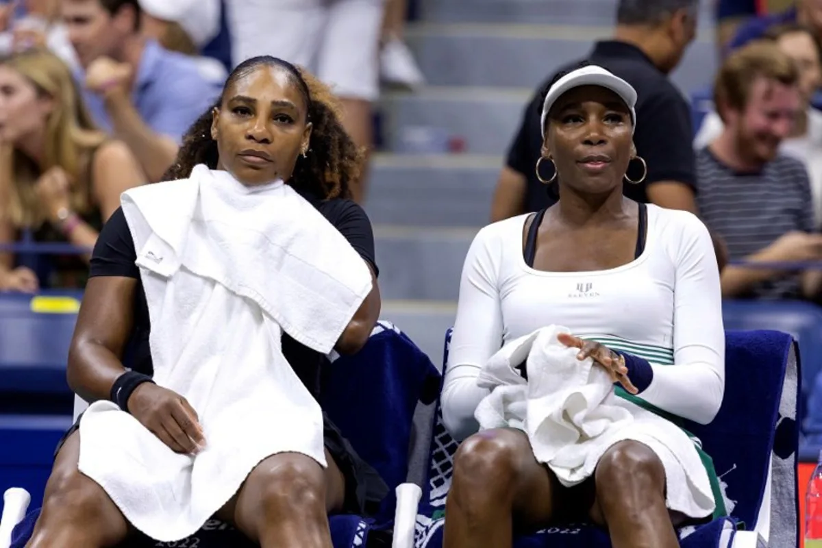USA's Serena Williams (L) and Venus Williams sit on the bench between games as they play against Czech Republic's Lucie Hradecka and Linda Noskova during their 2022 US Open Tennis tournament women's doubles first round match at the USTA Billie Jean King National Tennis Center in New York, on September 1, 2022. COREY SIPKIN / AFP